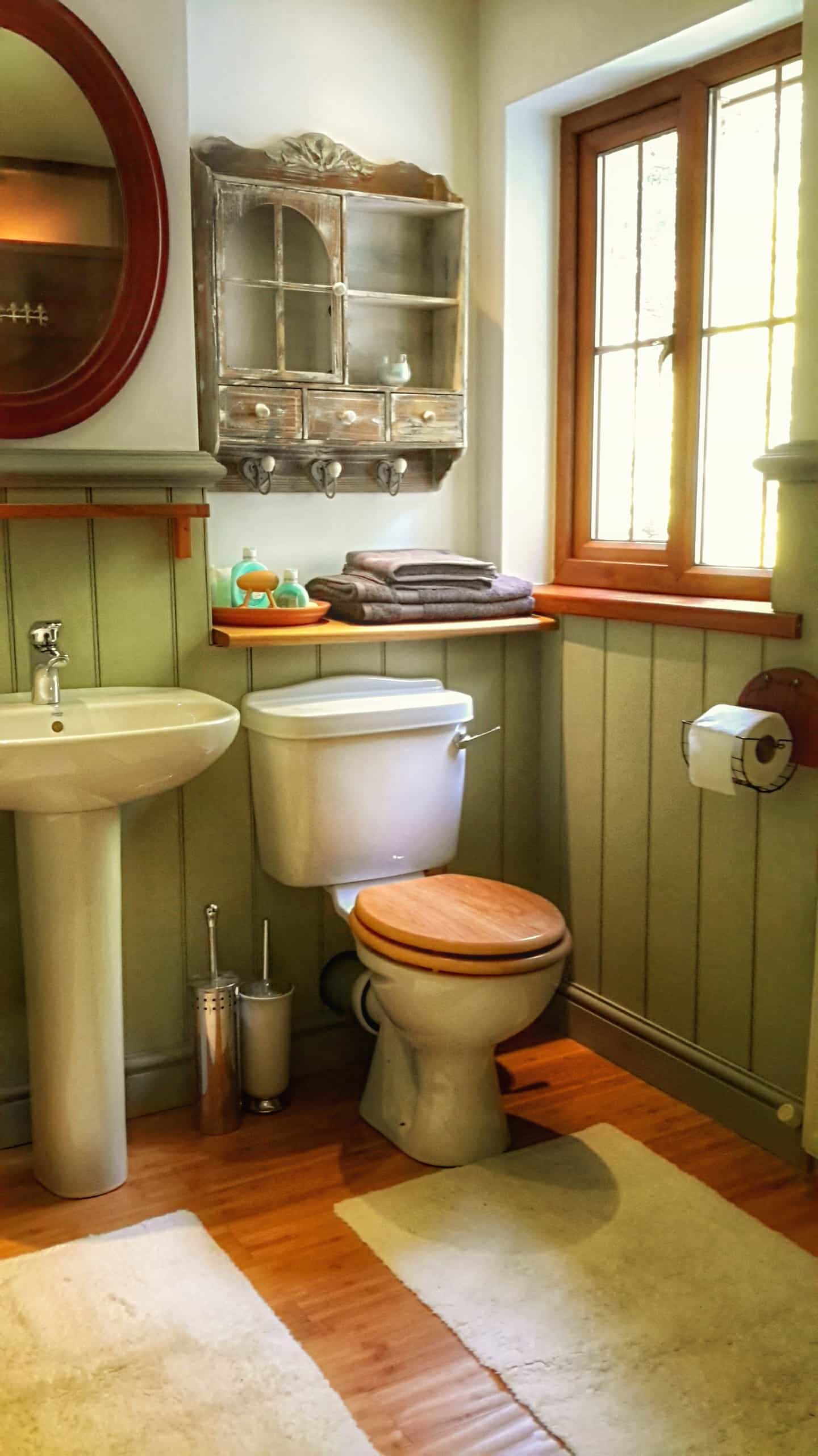 private bathroom with shower and cast iron bath tub